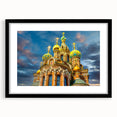 Abstract art print of a colorful European cityscape with textured details on a large framed canvas.