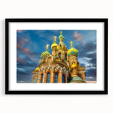 Abstract art print of a colorful European cityscape with textured details on a large framed canvas.