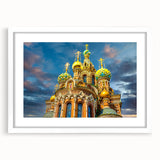 Textured abstract art print of a European cityscape in muted gray and blue tones, framed with a white mat.