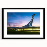 Extra large abstract art print featuring a colorful, textured depiction of a European scenery on a black framed canvas.