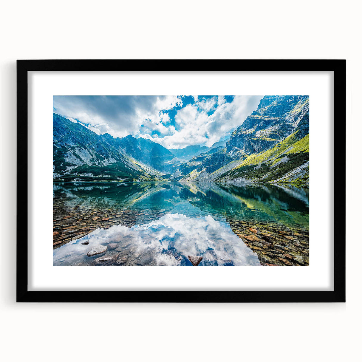 Abstract art print of a colorful European scenery in vibrant hues on a large textured canvas, framed in black.