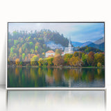 Large art print of a Slovenian landscape in muted green and blue tones on a white-framed acrylic.