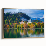 Framed canvas featuring a vintage-style landscape painting of a Slovenian scenery in muted gold and black tones.