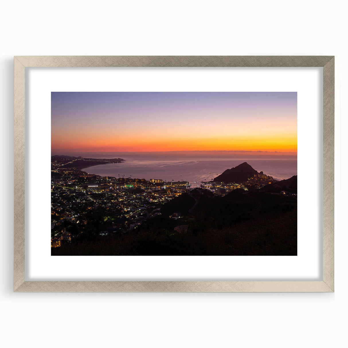 Textured abstract art print of Cabo San Lucas scenery in silver frame, ideal for bedroom ambiance.
