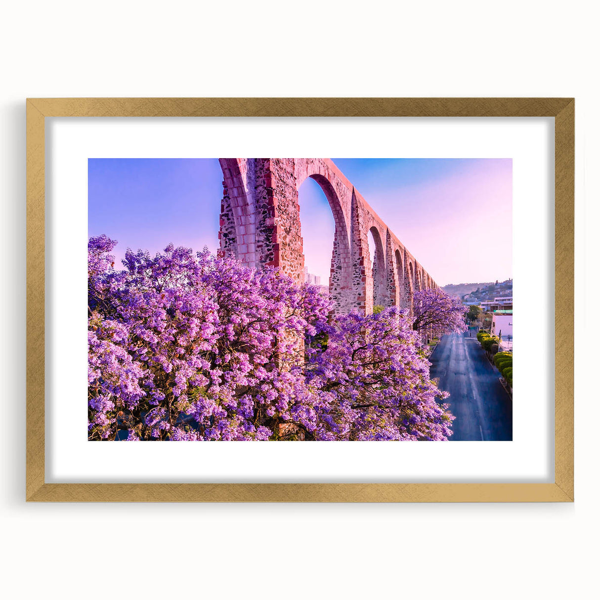 Extra large abstract art print of Guanajuato, Mexico, in gold frame, featuring textured, vibrant colors.