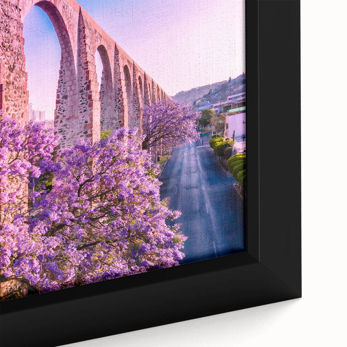 Framed canvas featuring a textured depiction of Guanajuato, Mexico with vibrant, colorful architecture.