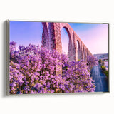 Framed canvas of a vintage-style landscape painting depicting Guanajuato, Mexico, with vibrant colors on a black background.