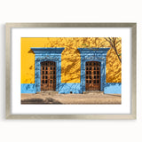 Textured art depicting abstract scenery of Oaxaca in muted earth tones, framed with a silver mat, ideal for bedroom decor.