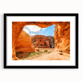 Abstract art print of a Middle Eastern desert scene in vibrant orange and red tones on a large textured canvas.
