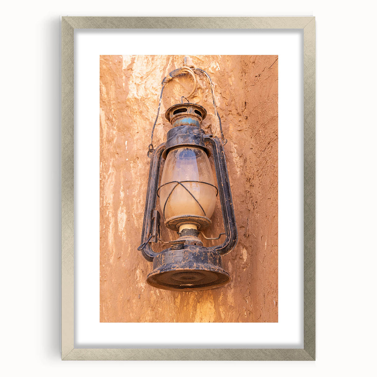 Textured abstract art print of a Middle Eastern scenery in muted earth tones on a framed canvas, suitable for bedroom decor.