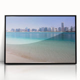 Large abstract wall art depicting the Abu Dhabi skyline in muted gray and blue tones on a framed acrylic.