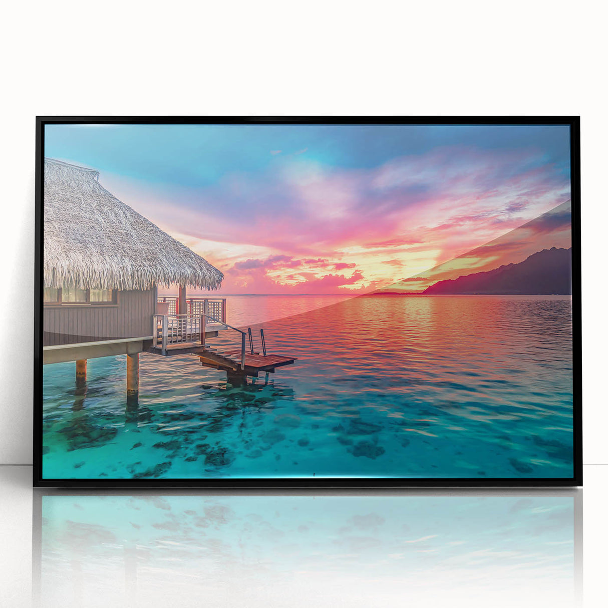 Large abstract wall art of Tahiti's oceanic scenery in vibrant blues and greens, framed in black acrylic.