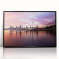 Large abstract wall art depicting the Auckland skyline in muted gray and blue tones, framed in black acrylic.
