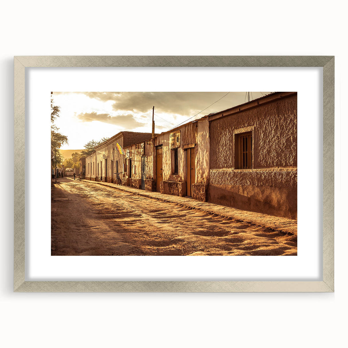 Textured art depicting abstract Santiago skyline in muted earth tones on a framed silver mat, suitable for bedroom decor.