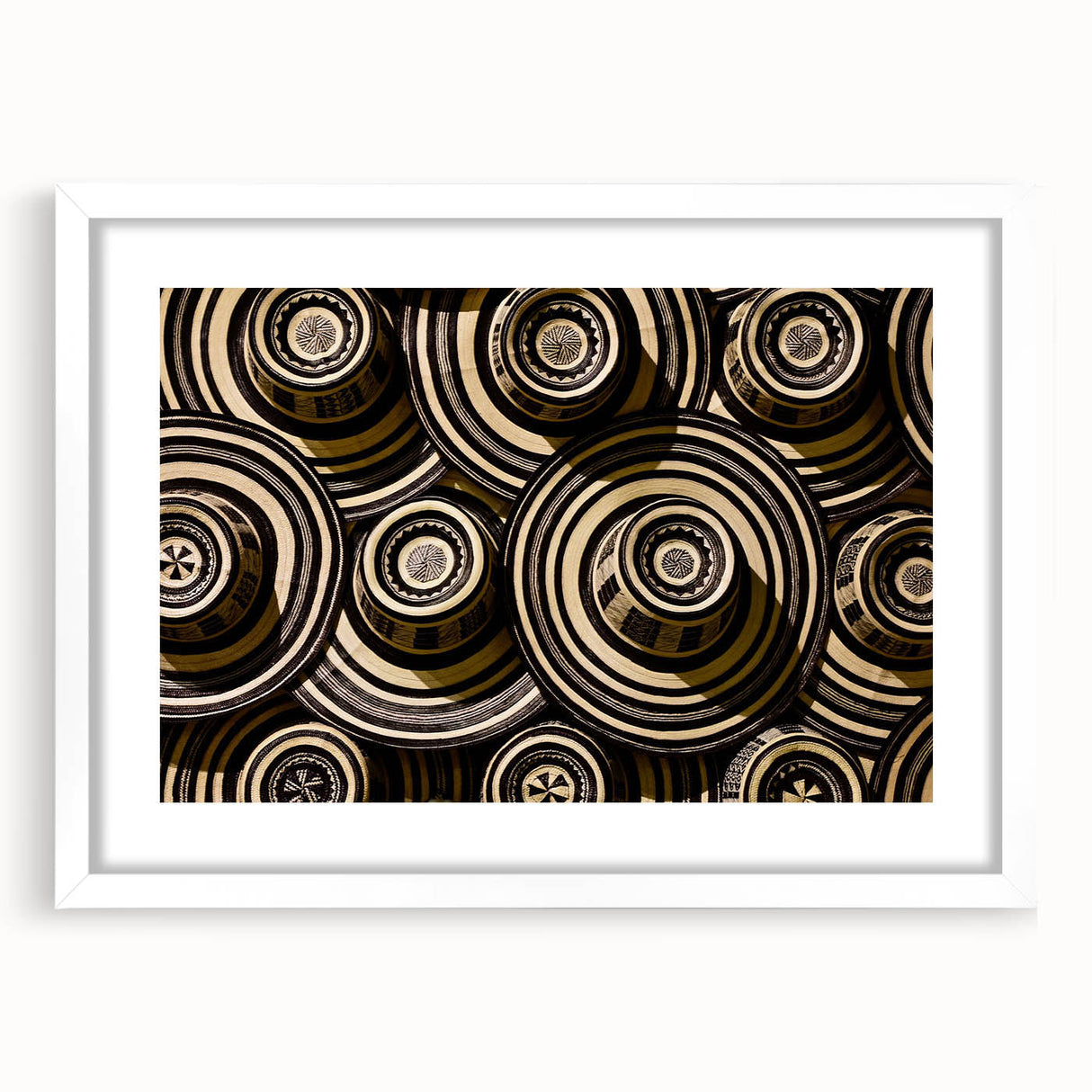 Abstract art print of a Colombian landscape in muted greens and blues on a framed white mat, ideal for dining room decor.