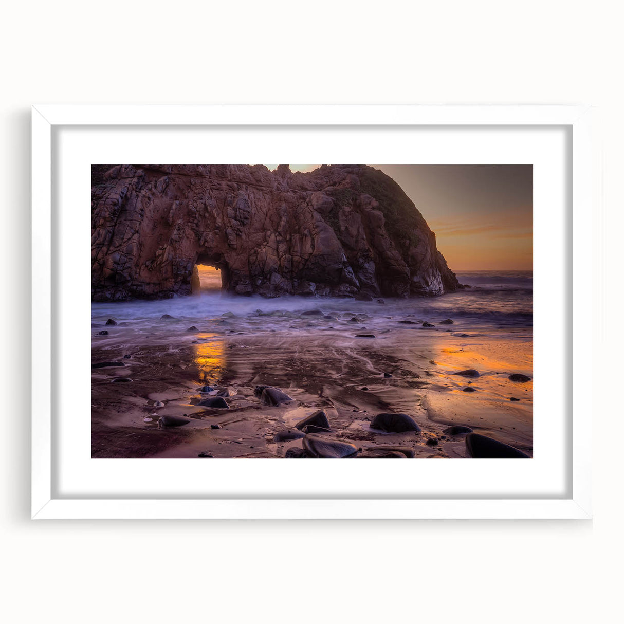 Abstract art print of Big Sur coastline in muted blue and green tones, framed with a white mat.