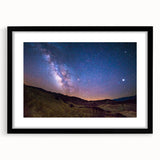 Abstract art print of Death Valley in colorful, textured strokes on a large framed canvas, ideal for living room decor.