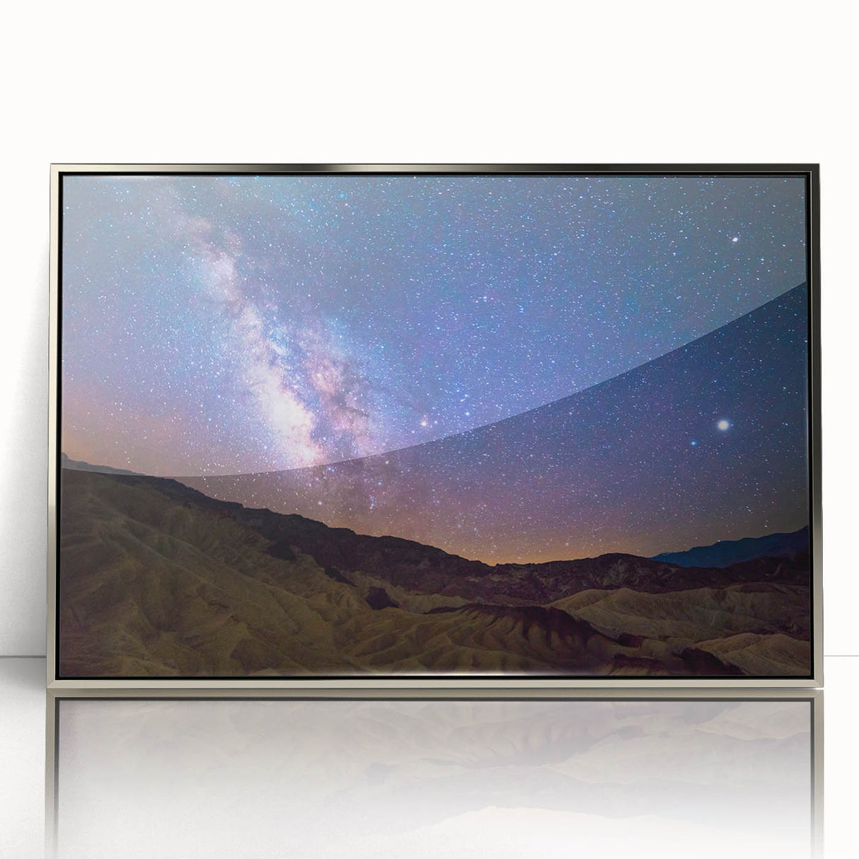 Mid-century modernist art depicting Death Valley in muted earth tones on a silver-framed acrylic print.