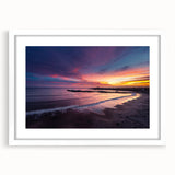 Abstract art print of Santa Cruz featuring vibrant blue and orange hues, framed with a white mat.