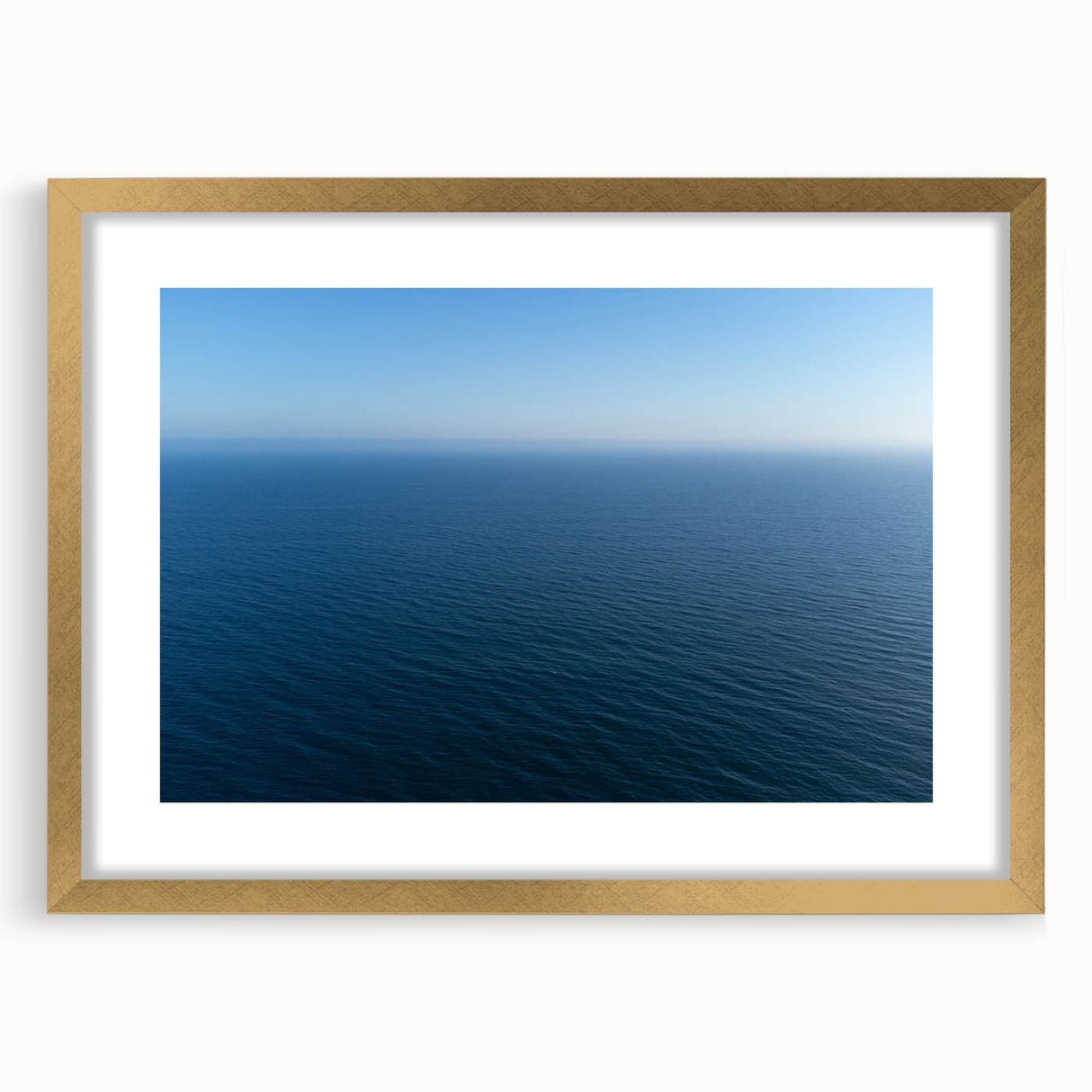 Extra large abstract art print depicting a textured Santa Monica scenery in muted earth tones, framed in gold.