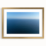 Extra large abstract art print depicting a textured Santa Monica scenery in muted earth tones, framed in gold.
