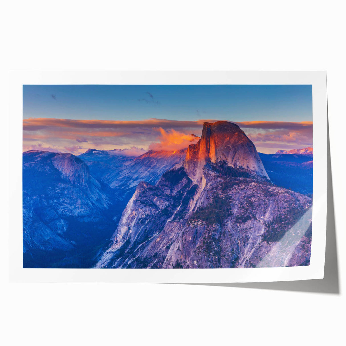 Yosemite landscape on rolled print, featuring muted green and blue tones, suitable for dining room wall art.