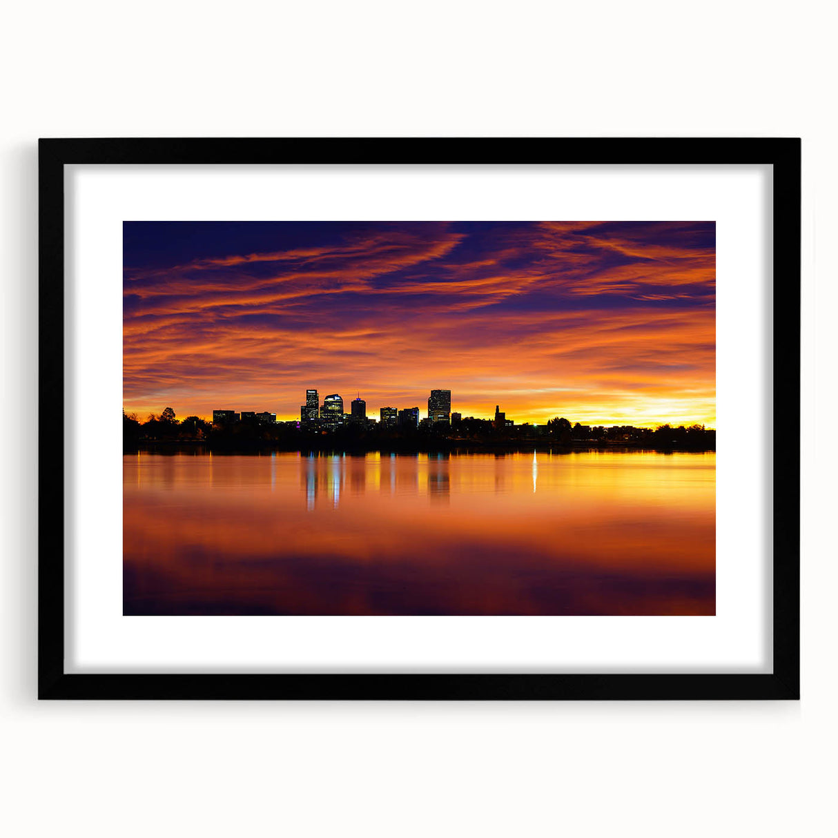 Abstract art print of Denver skyline in colorful textured style on a large black-framed canvas, ideal for living room decor.