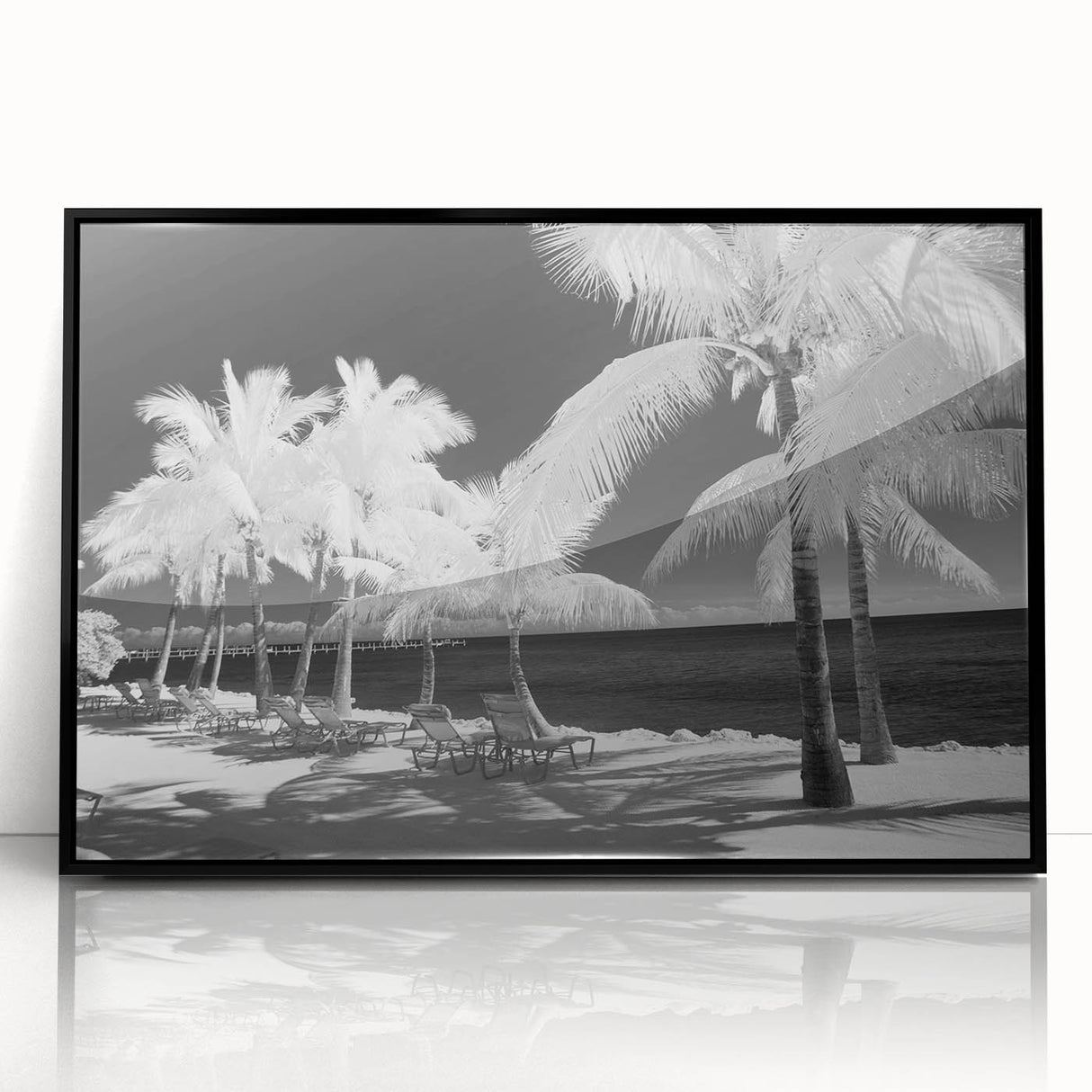 Large abstract wall art depicting the Florida Keys in muted blue and green tones, framed in black acrylic.