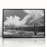 Large abstract wall art depicting the Florida Keys in muted blue and green tones, framed in black acrylic.