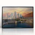 Large abstract wall art of Tampa scenery in muted blue tones on a black framed acrylic.