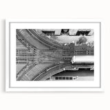 Abstract art print of the Chicago skyline, featuring muted gray and blue tones on a framed white mat.