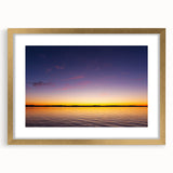 Extra large abstract art print of Lake Michigan, with textured waves in muted blue tones, framed in gold.