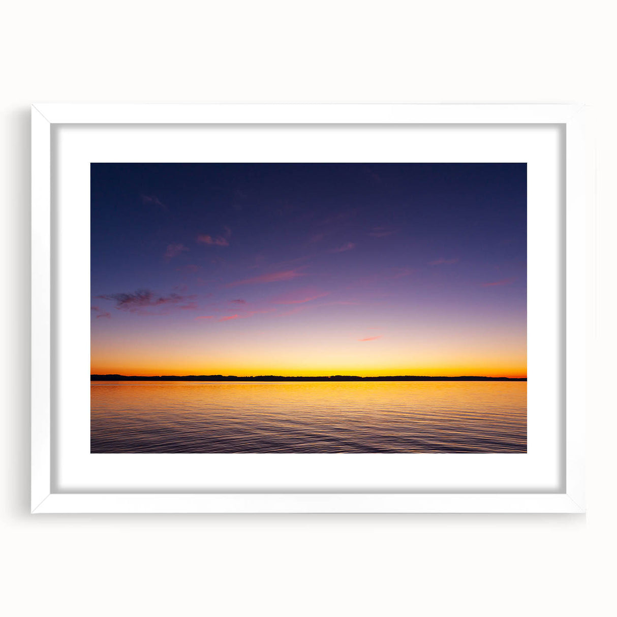 Abstract art print of Lake Michigan with soft blue and gray tones on a framed white mat.