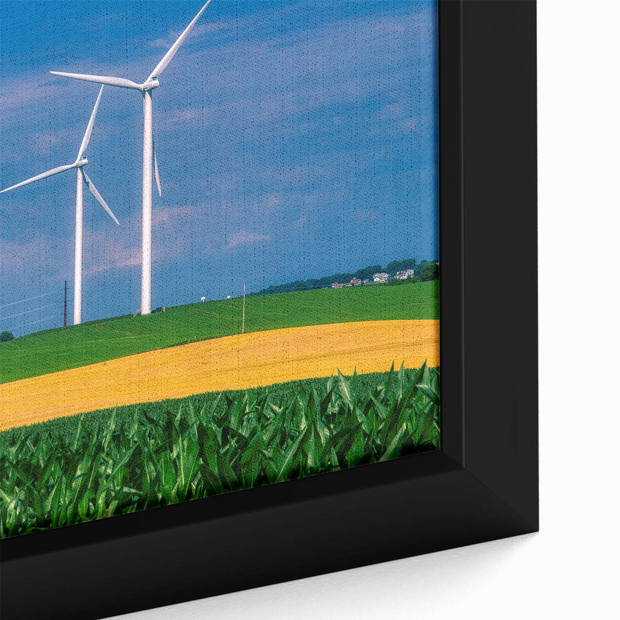 Close-up of a textured black wall art depicting Iowa scenery on framed canvas, featuring vibrant color accents.