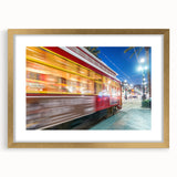 Extra large abstract art print of New Orleans scenery in gold frame with mat, featuring textured design in vibrant colors.
