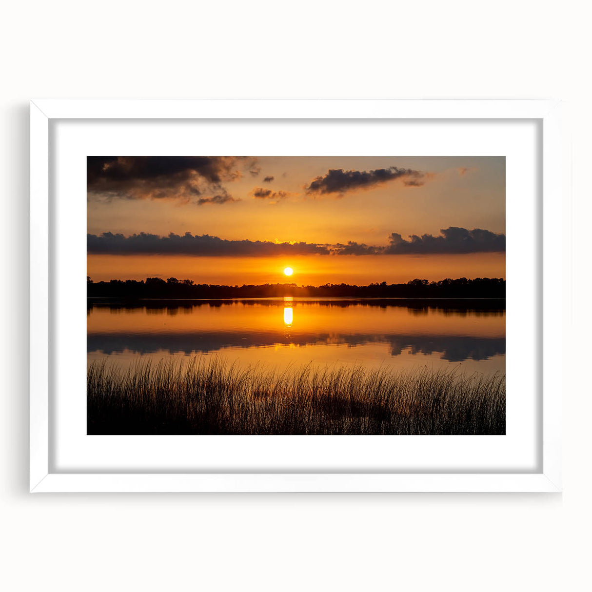 Abstract art print depicting a serene Minnesota landscape in soft blue and green tones on a framed white mat.