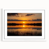 Abstract art print depicting a serene Minnesota landscape in soft blue and green tones on a framed white mat.