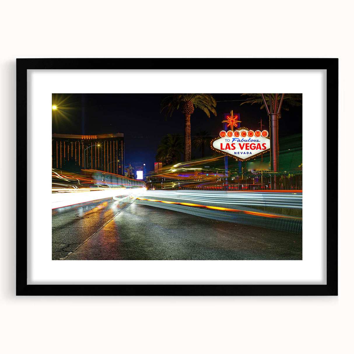 Colorful abstract art print of Las Vegas scenery in a black frame, ideal for extra large wall art in a living room.