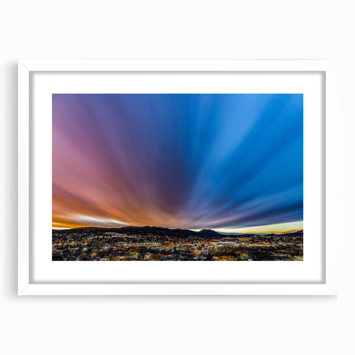 Abstract art print of a New Mexico landscape in muted earth tones on a framed white mat, suitable for dining room decor.