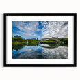 Abstract art print of Charlotte skyline featuring vibrant, colorful textures on a large framed canvas.