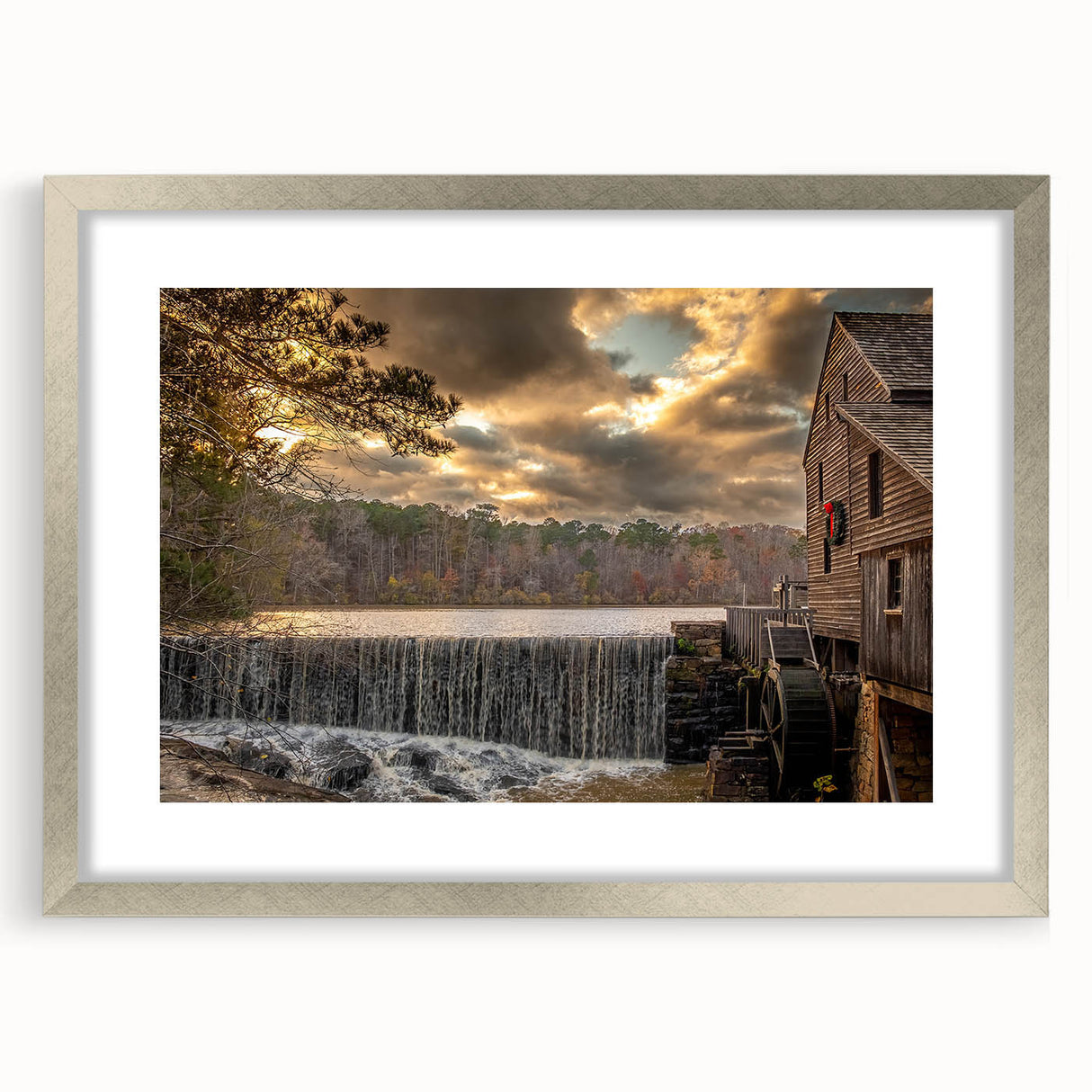Textured abstract art print of Raleigh skyline in muted earth tones, framed with a silver mat, ideal for bedroom decor.
