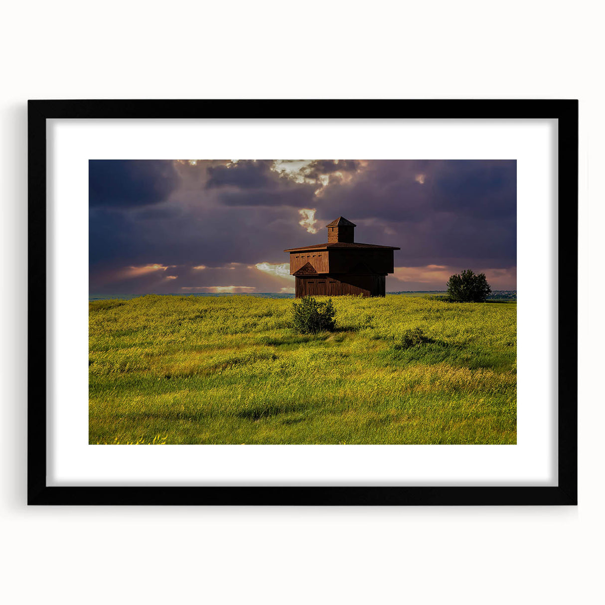 Abstract art print of North Dakota scenery in vibrant colors on a textured, extra large canvas, framed in black.