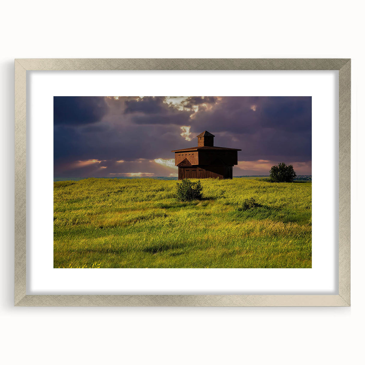 Textured abstract art print of North Dakota scenery in muted earth tones, framed in silver, ideal for bedroom art.