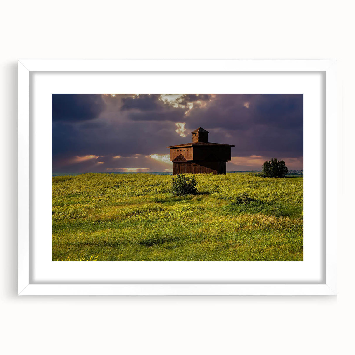 Abstract art print of North Dakota scenery in muted earth tones on a white framed canvas, ideal for dining room decor.