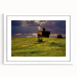 Abstract art print of North Dakota scenery in muted earth tones on a white framed canvas, ideal for dining room decor.