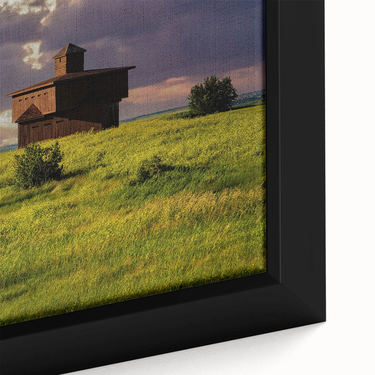 Black wall art featuring a textured North Dakota landscape on a large framed canvas, with colorful accents.