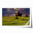 Large rolled print featuring a serene North Dakota landscape with soft floral elements in muted greens and blues.