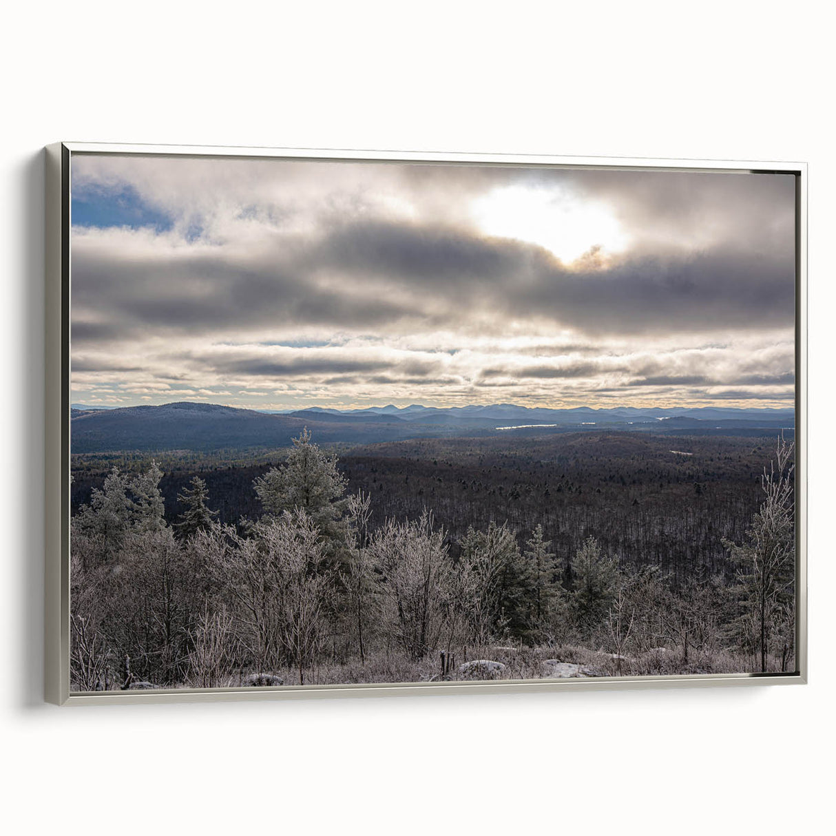 Framed canvas of a vintage-style landscape painting depicting the Adirondacks, with colorful art on a black background.