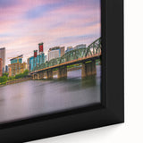 Close-up of textured black wall art depicting Portland, Oregon, with vibrant color splashes on framed canvas.