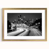 Extra large abstract art print of Pittsburgh skyline in muted gray and gold tones on a framed canvas.